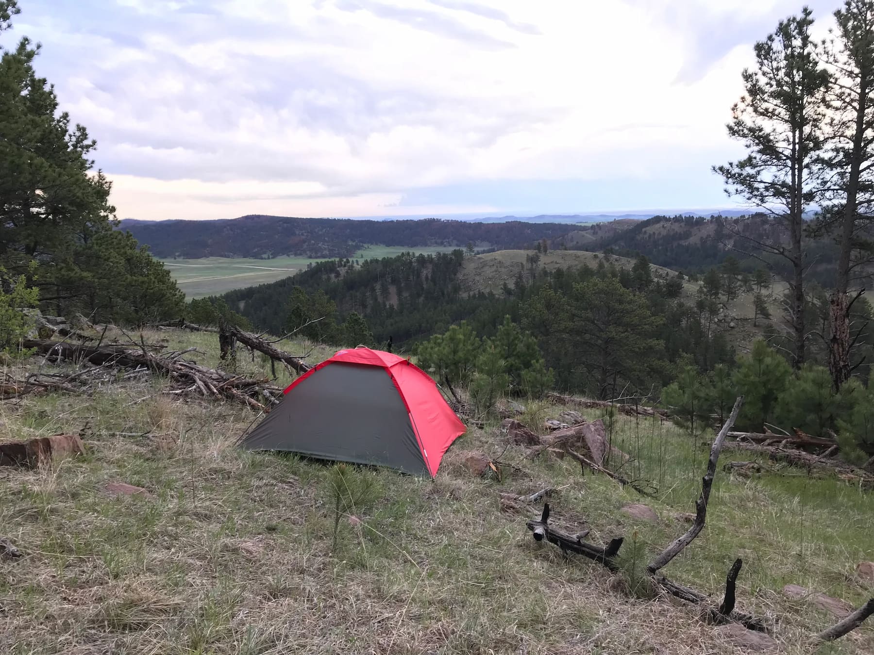 Red tent in the hills overlooking Elk Mountain.