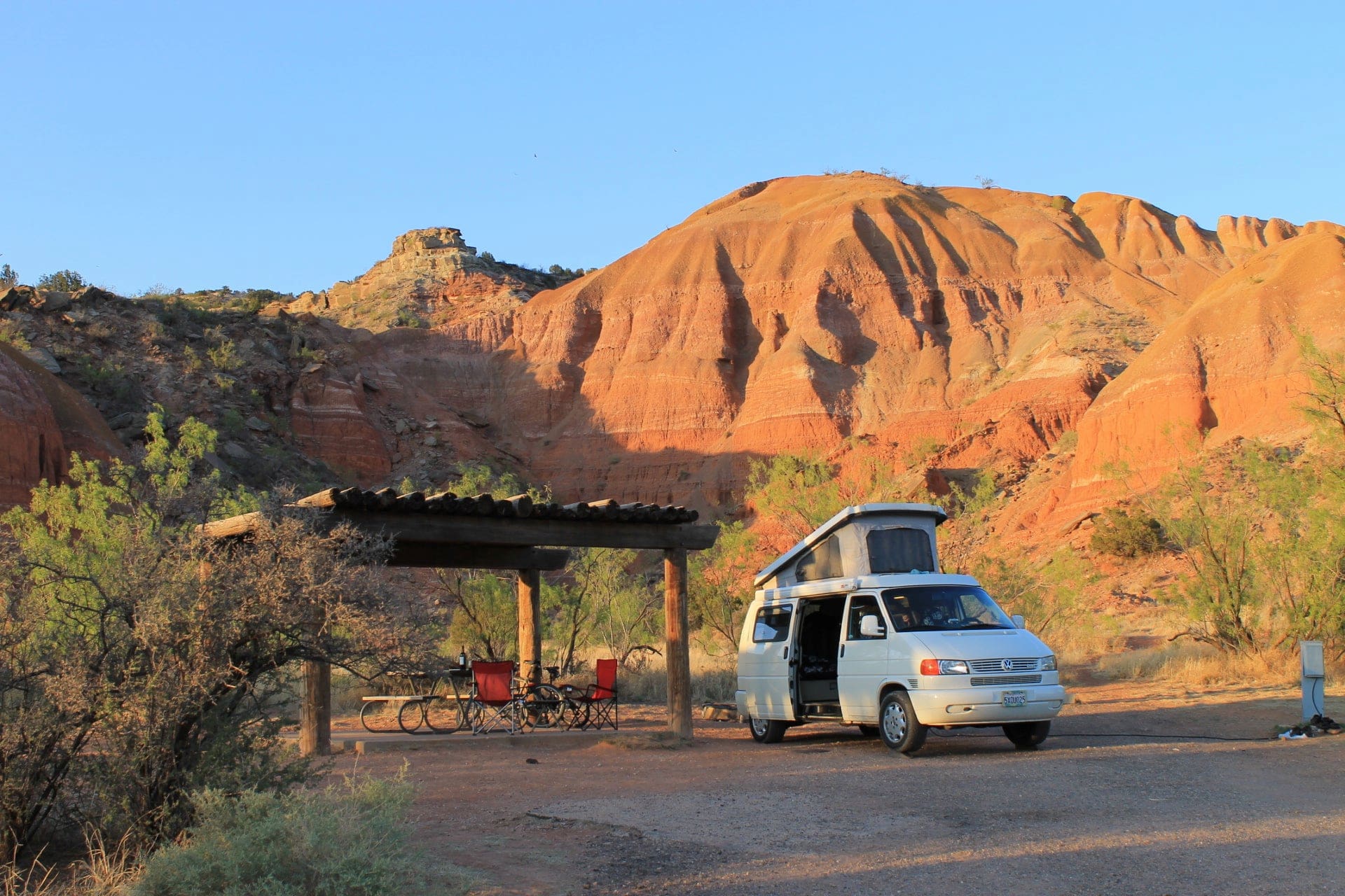 Van with pop up tent in the red rocks of Palo Duro Canyon.