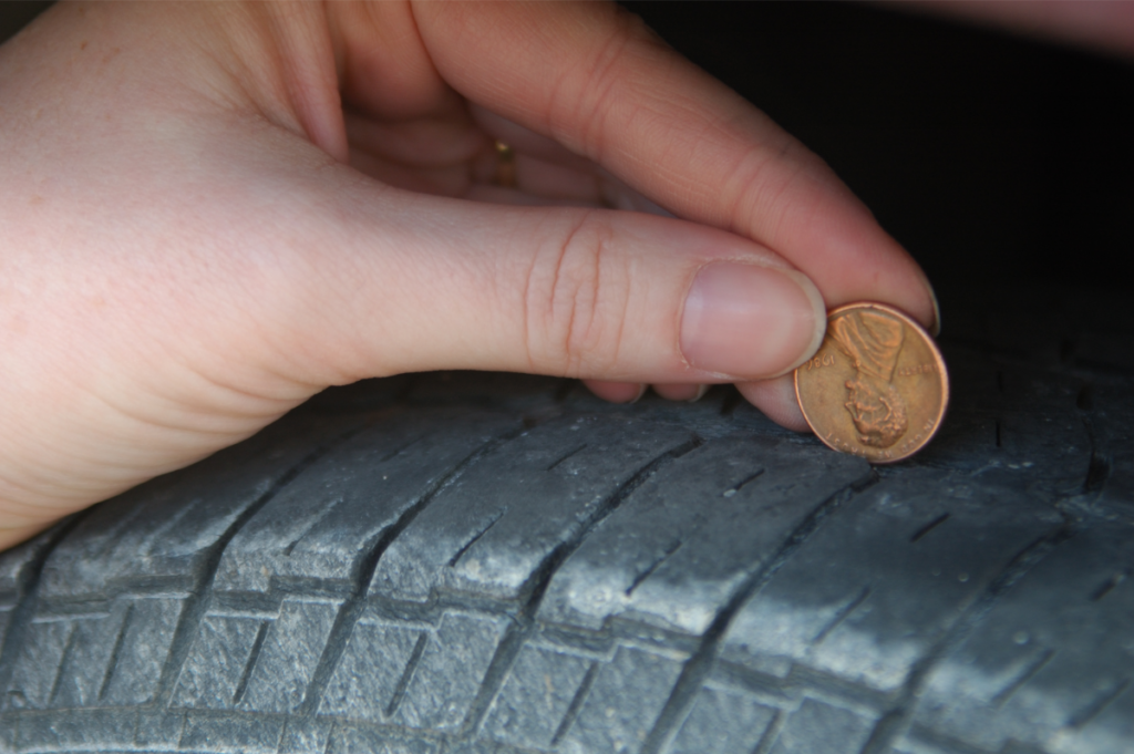  A penny placed into the tread of a tire
