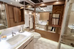 The rear bath in the featured unit offers plentiful storage space, including a mirrored wardrobe.