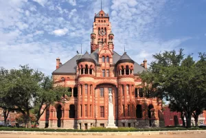 The historic Ellis County Courthouse in nearby Waxahachie is composed of mostly pink granite and red sandstone.
