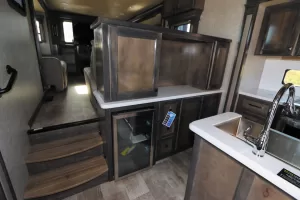 The hutch that separates the galley from the den incorporates a wine cooler.
