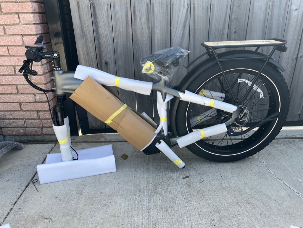 An unassembled electric bike still packed in wrapping materials