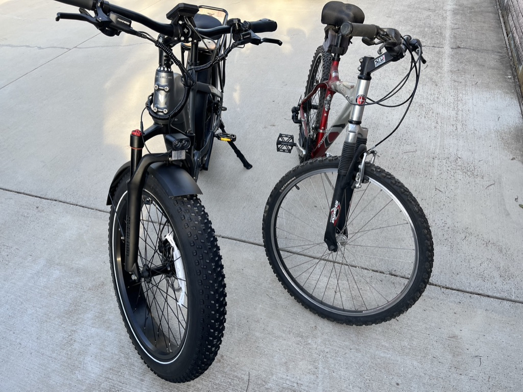 The Mokwheel eBike and a standard mountain bike side by side