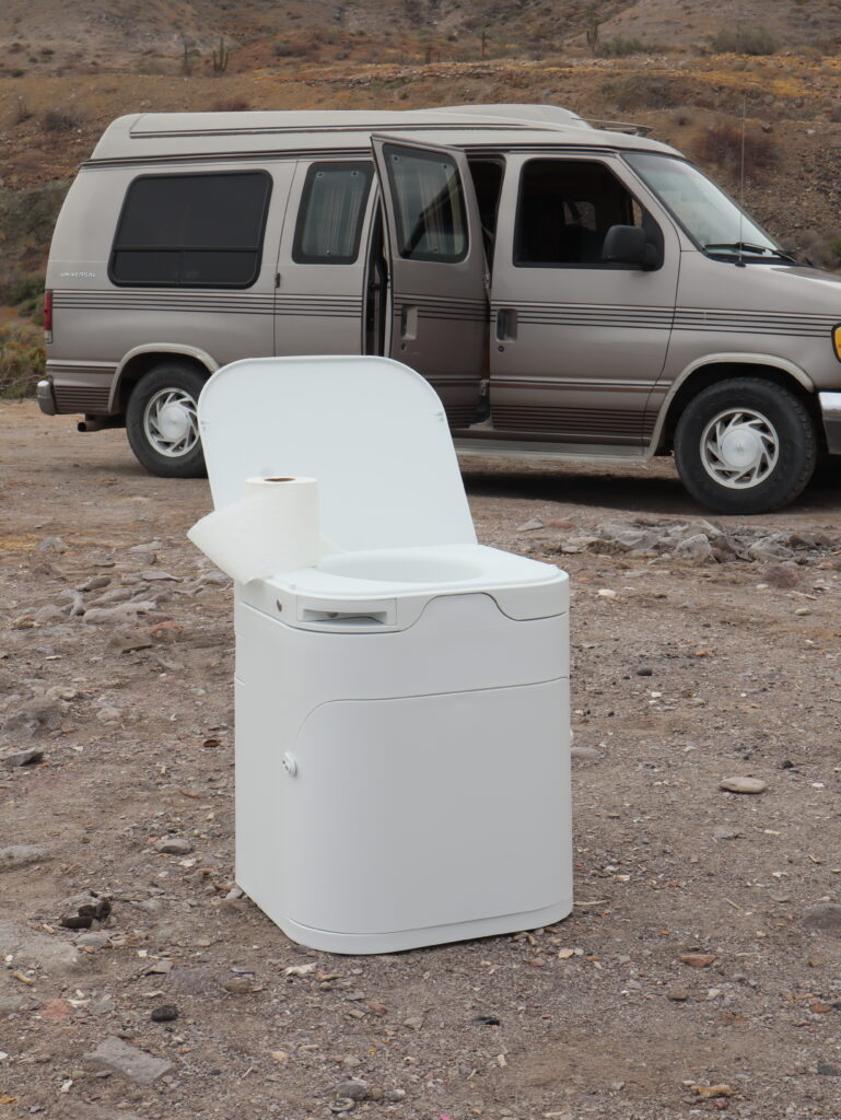OGO Composting Toilet in front of a camper van
