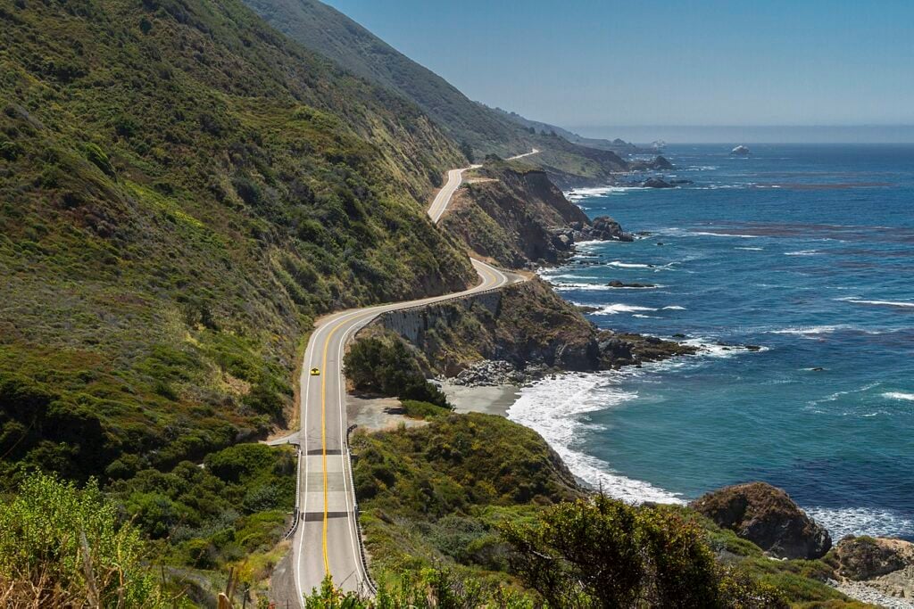 A car driving along the California coast