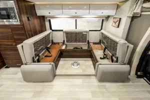 The 24J and 24D include storage compartments beneath bench seats in the U-shaped dinette.