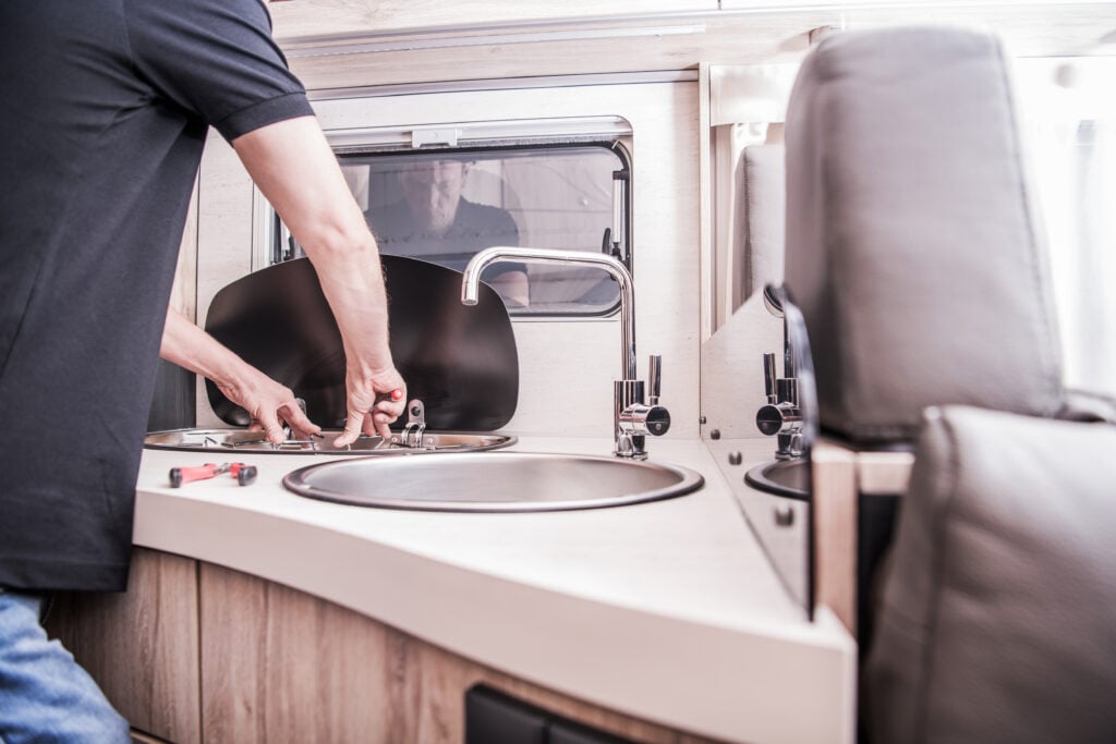 person doing RV repair work, a mobile service tech