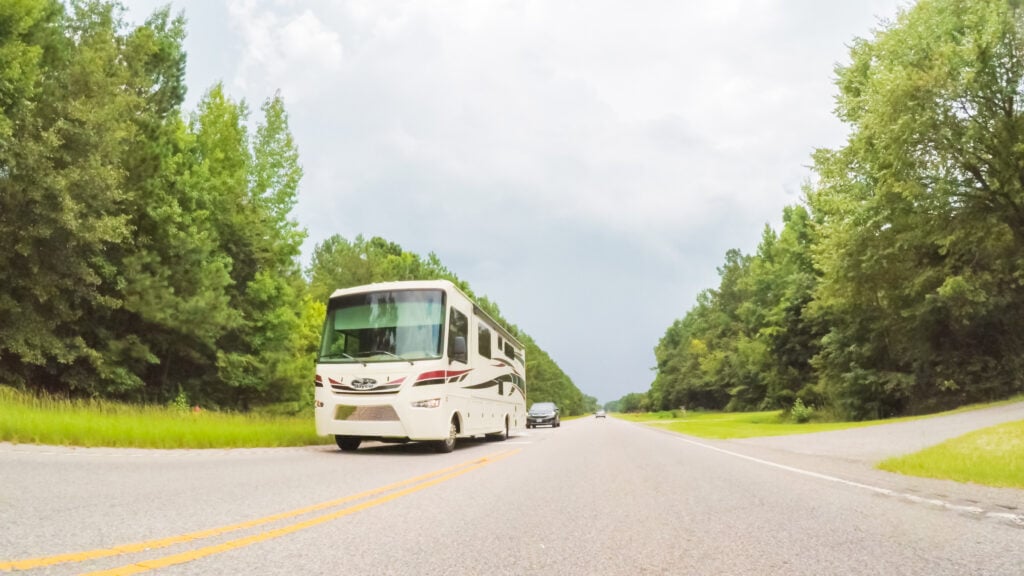 motorhome on highway, featured image for new RVer mistakes