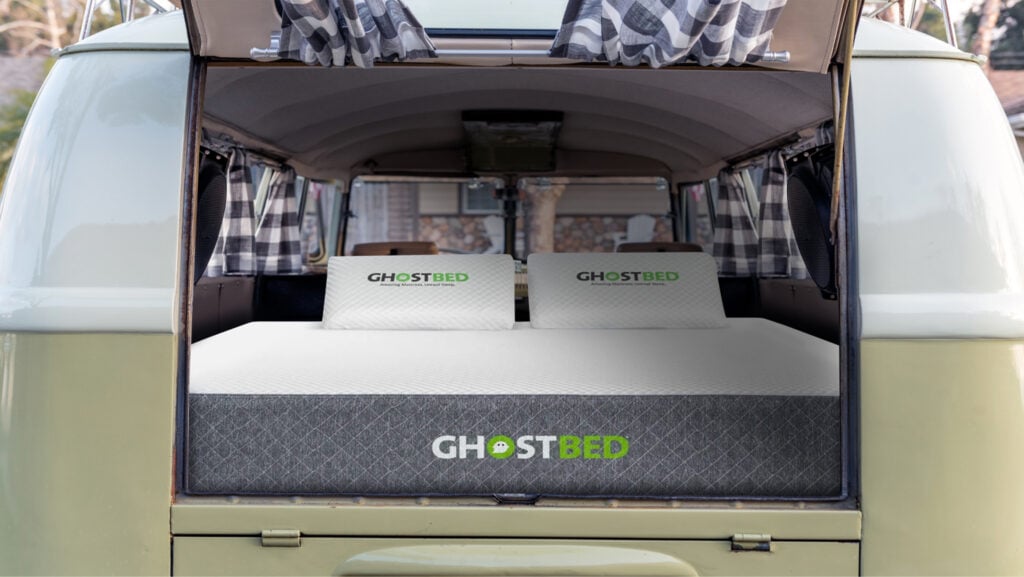 Rear of a camper van with a ghostbed mattress installed allows RVers to stay cool sleeping in the summer.