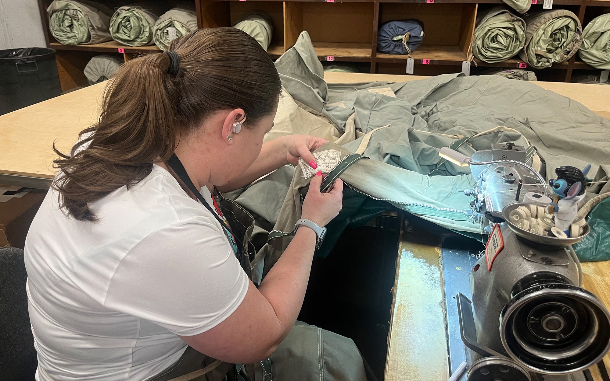 Springbarâs tent repair specialist inspects the tag on this 50-year-old tent.