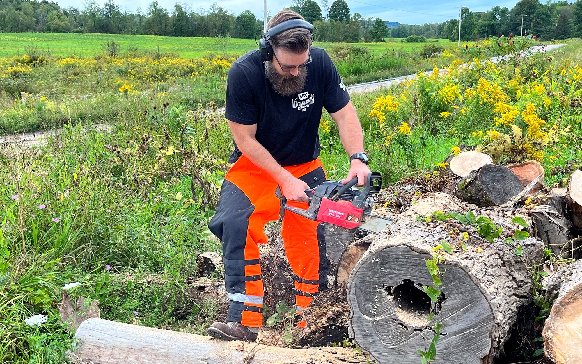 Author chops wood in the best chainsaw chaps.