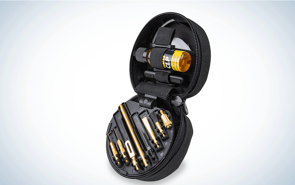 A black, circular pouch containing gun cleaning materials