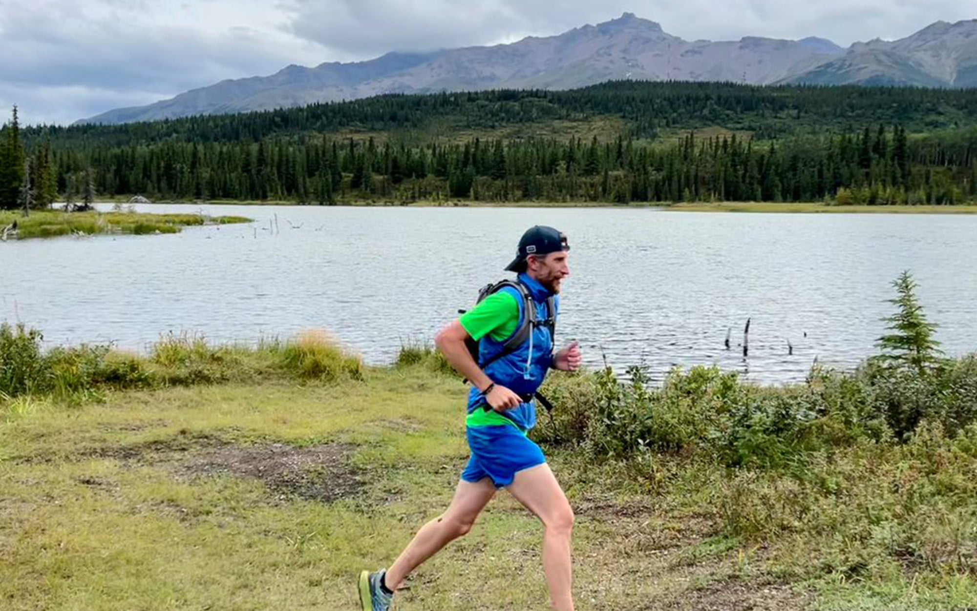 Runner wears REI hydration pack.