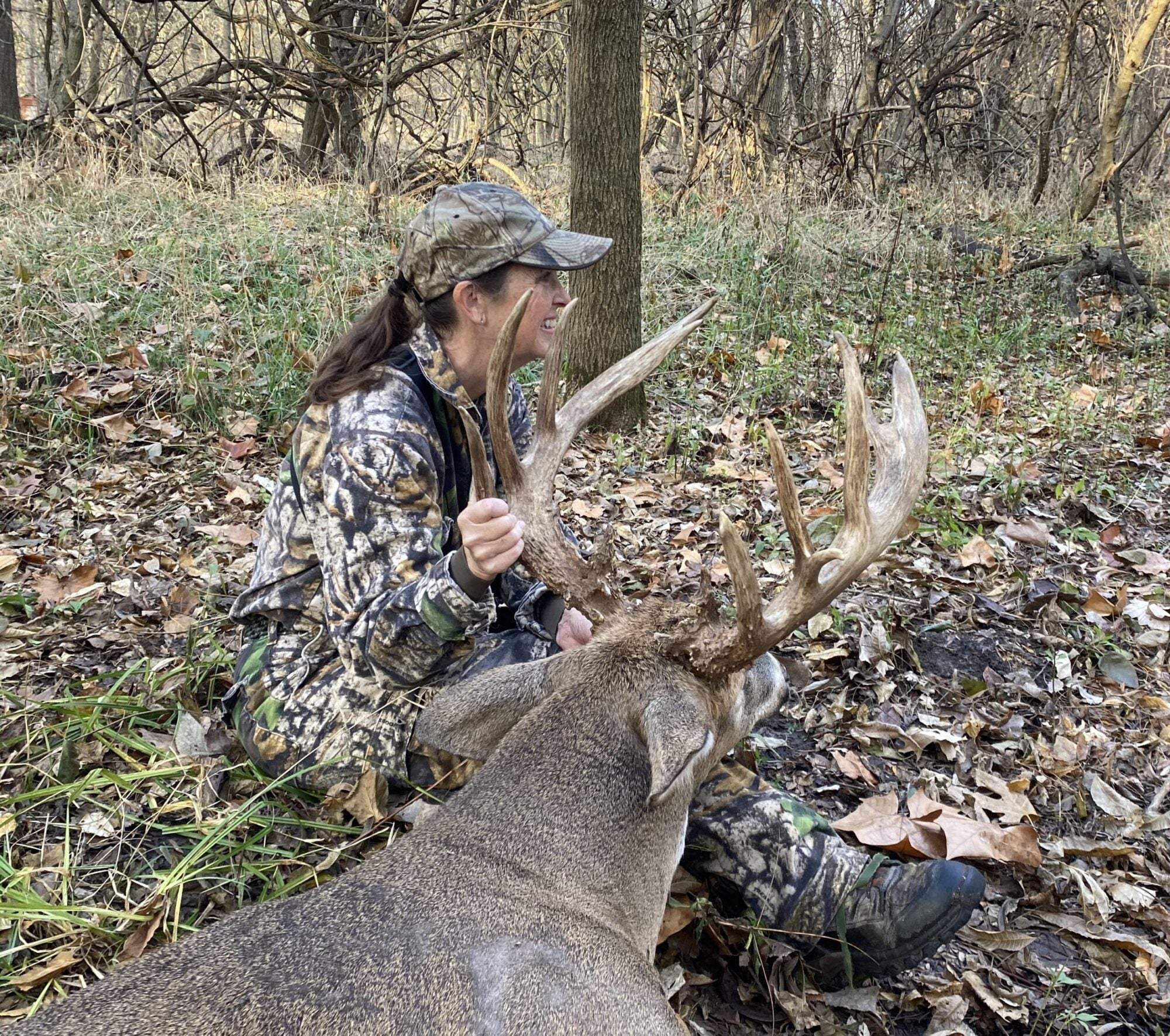 kristi purcell with a whitetail buck