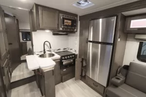 The galley includes a microwave, three-burner cooktop, and  10-cubic-foot DC refrigerator-freezer.
