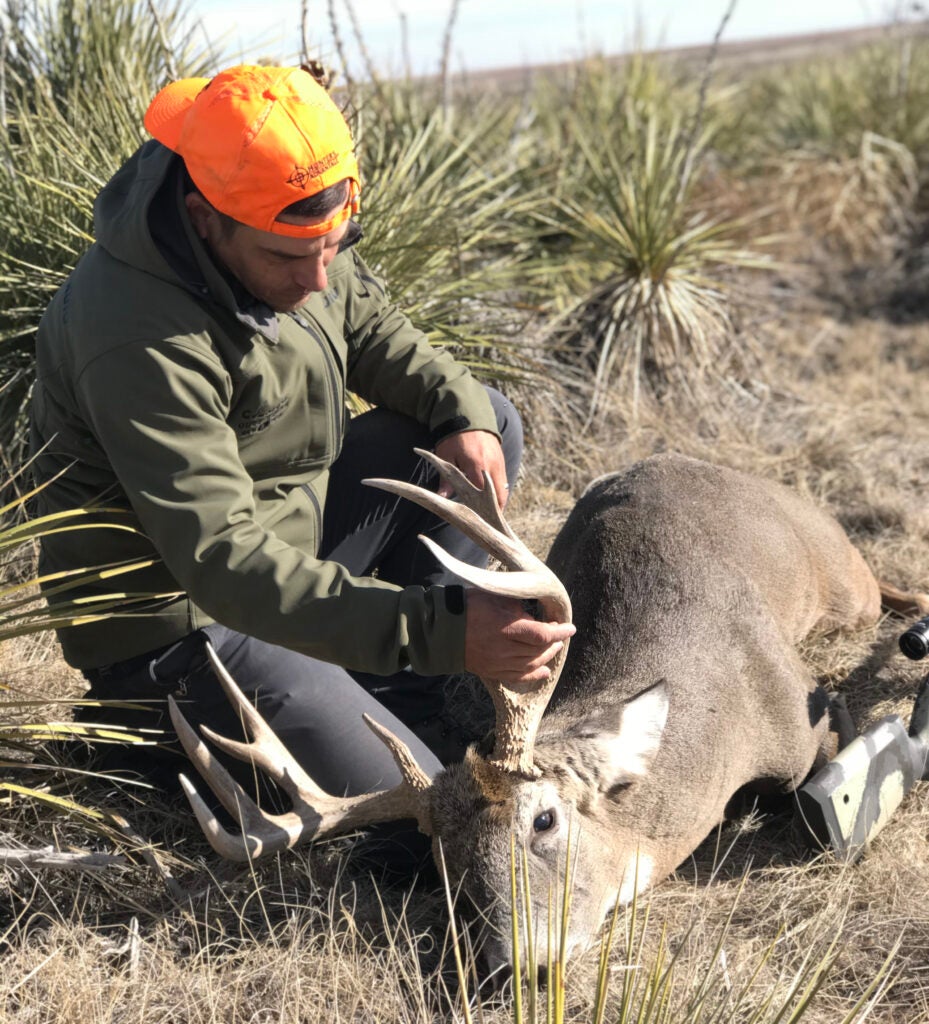 Cody Arnold with a big long-range whitetail buck.