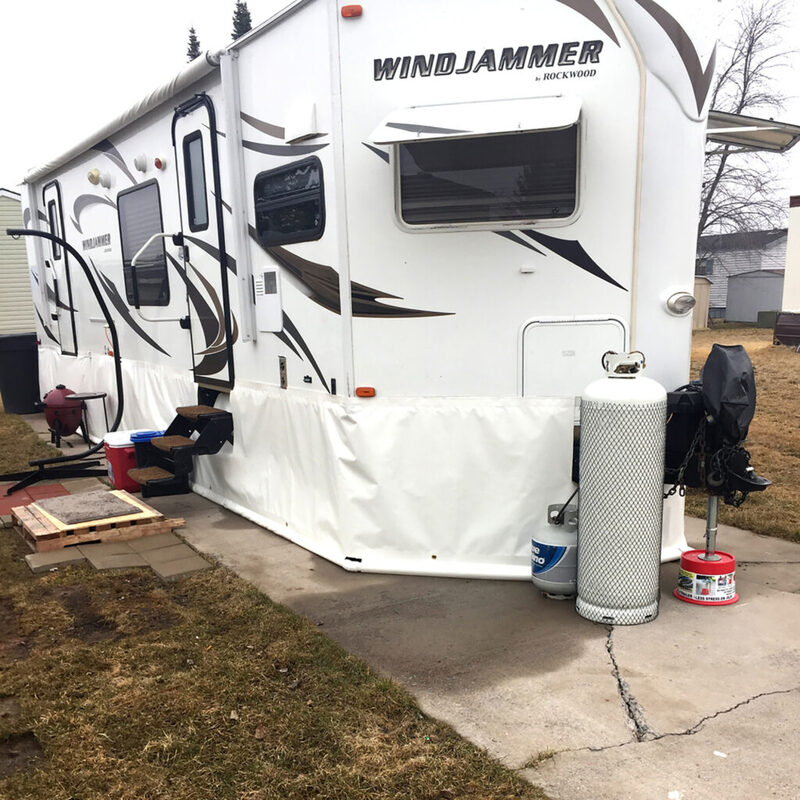 Travel trailer with skirting installed for RVing in the winter