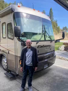 Bruce Wilson (shown here with the Bissillions’ current RV) enjoyed trips in MERV with his wife, Carol, for many years.