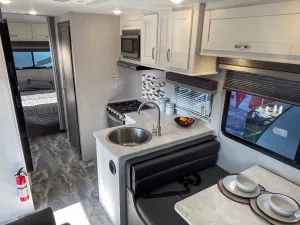 The galley has stainless-steel appliances and plenty of storage.