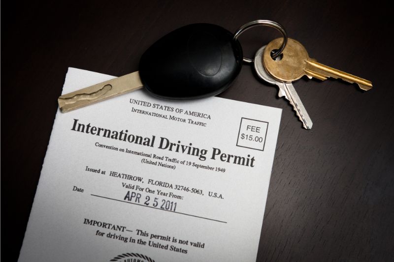 International drivers permit with a set of car keys on it