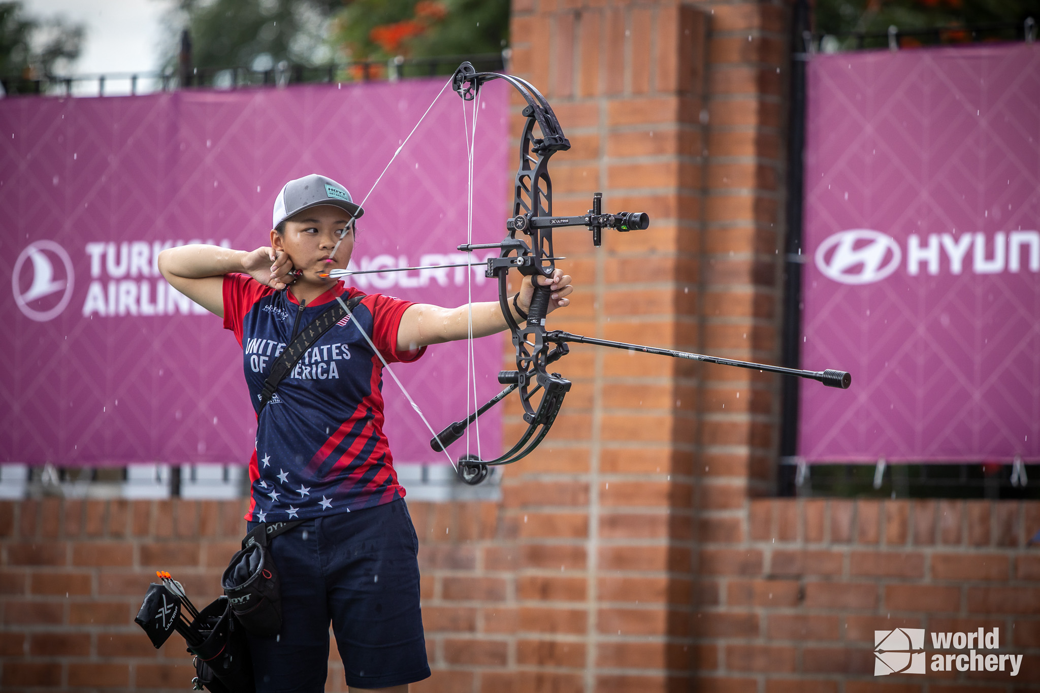 Liko Arreola shooting her bow in the rain in Colombia.