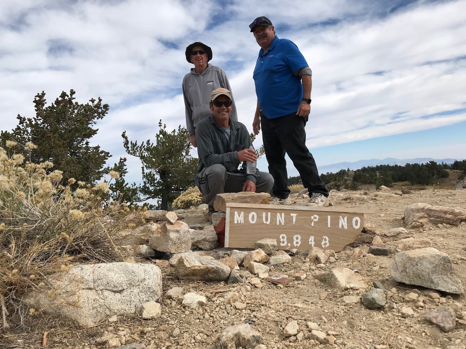 3 men on the peak of mount pinos