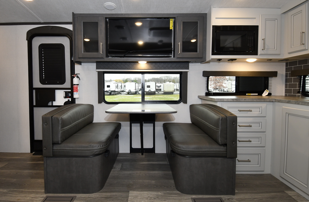The large LCD TV above the dinette is ideally positioned for your camping entertainment. The dinette converts into a bed large enough for two people.
