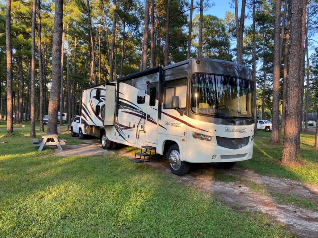 A motorhome in a campsite at New Green Acres RV Park.