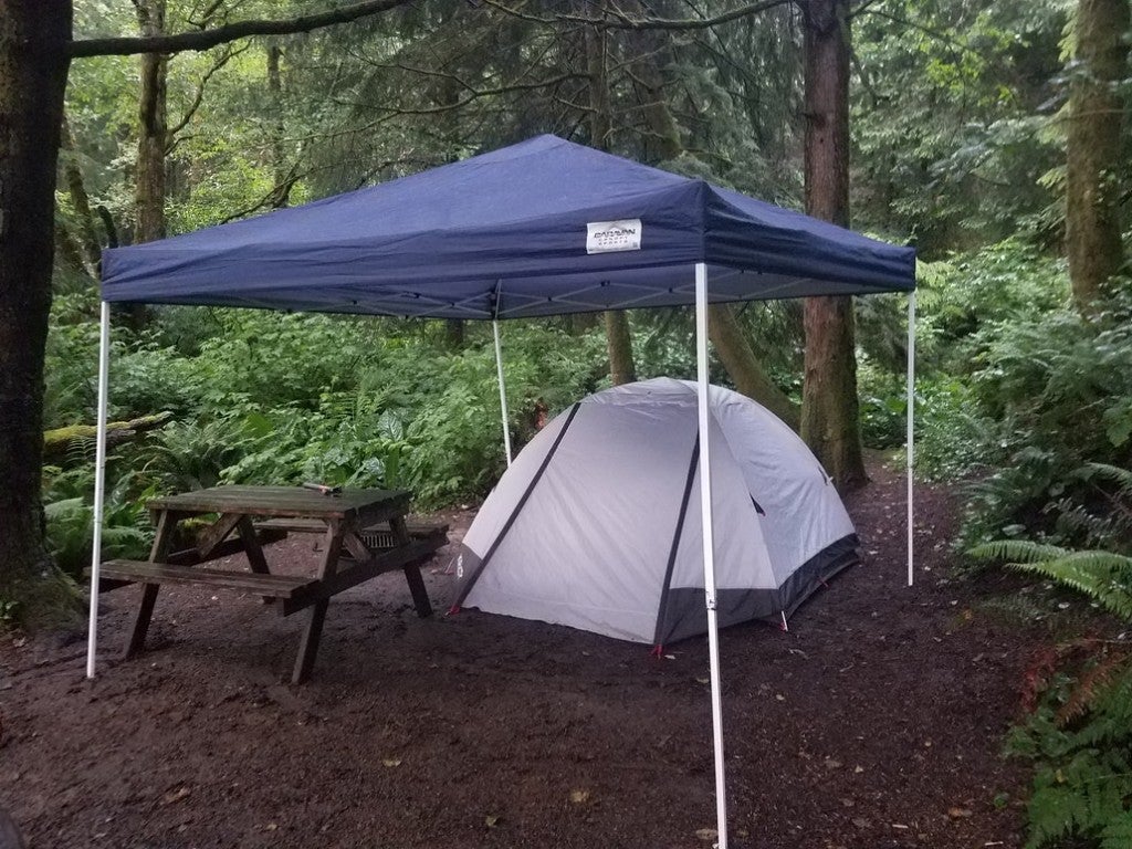 a canopy over a tent on a dirt rock site in oregon