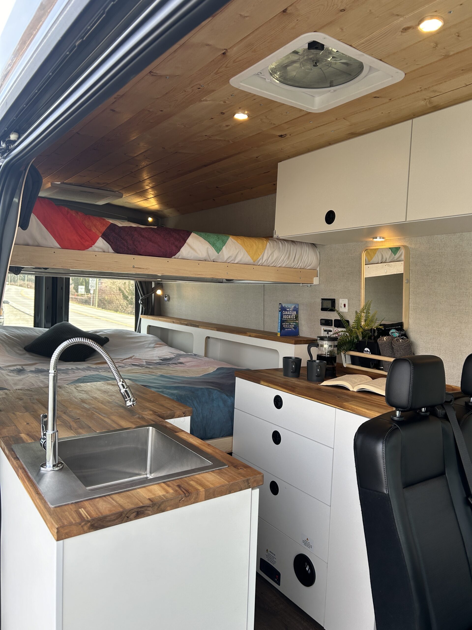Karma Campervans interior showing galley and seating