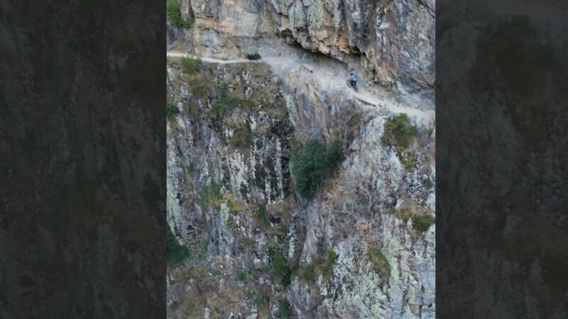 #DontLookDown: Mountain Biker Has No Business on This Cliff