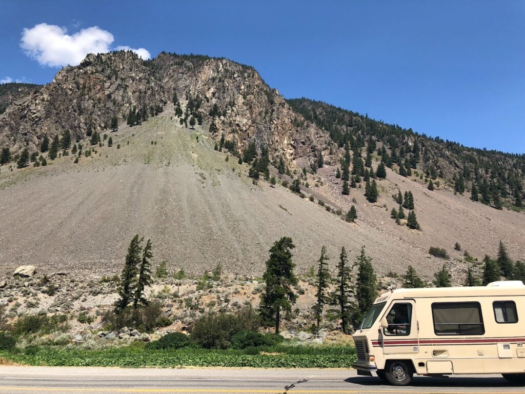 RV going camping in the mountains