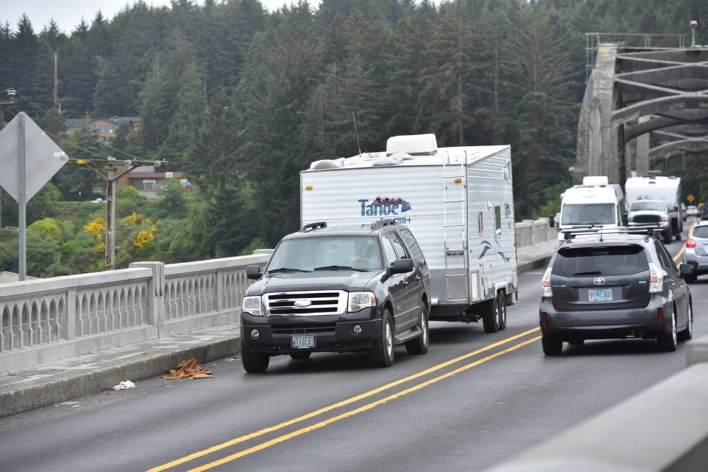 An SUV towing a trailer on a bridge. Photo: Bruce W. Smith