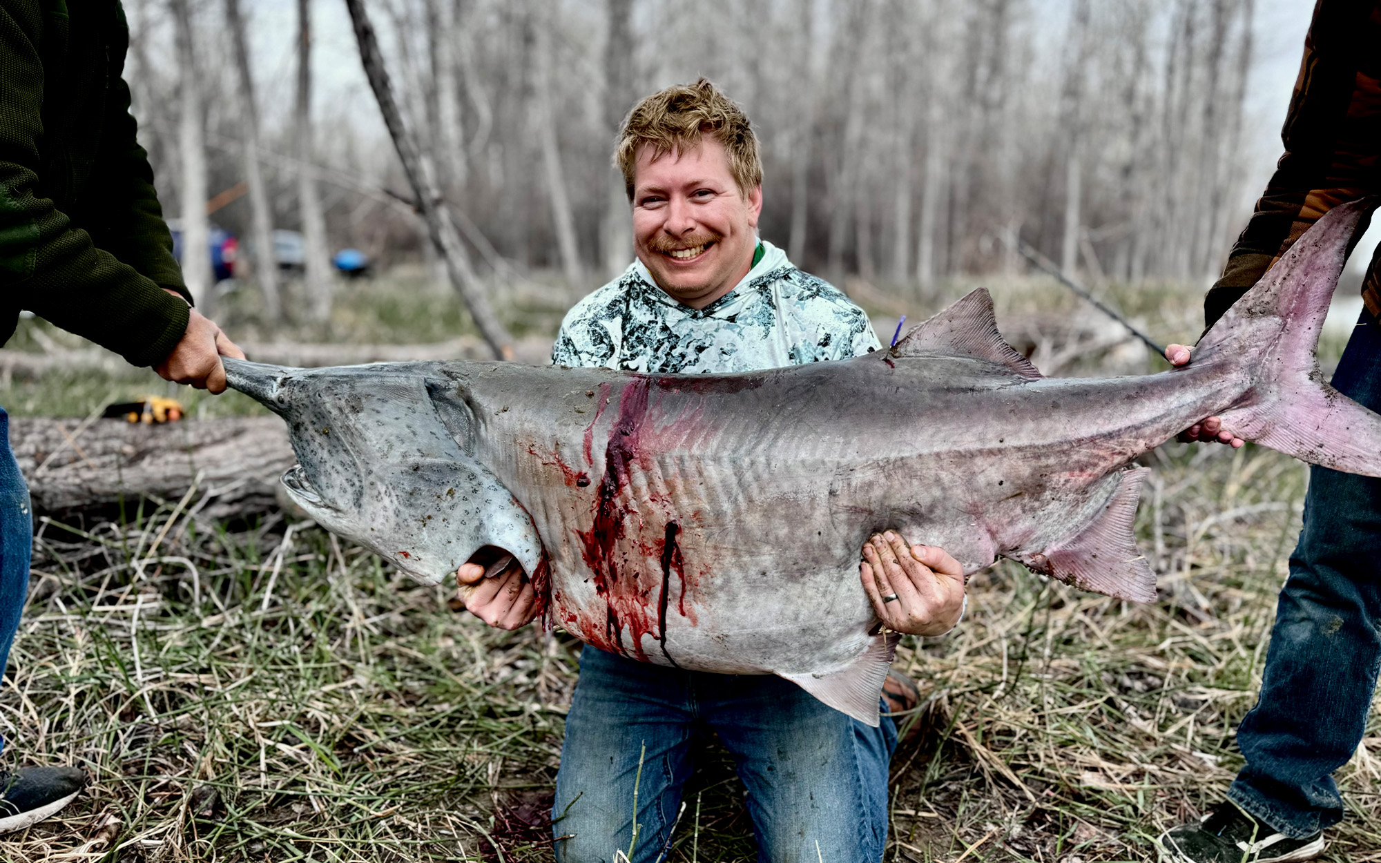 A North Dakota angler with a giant paddlefish.