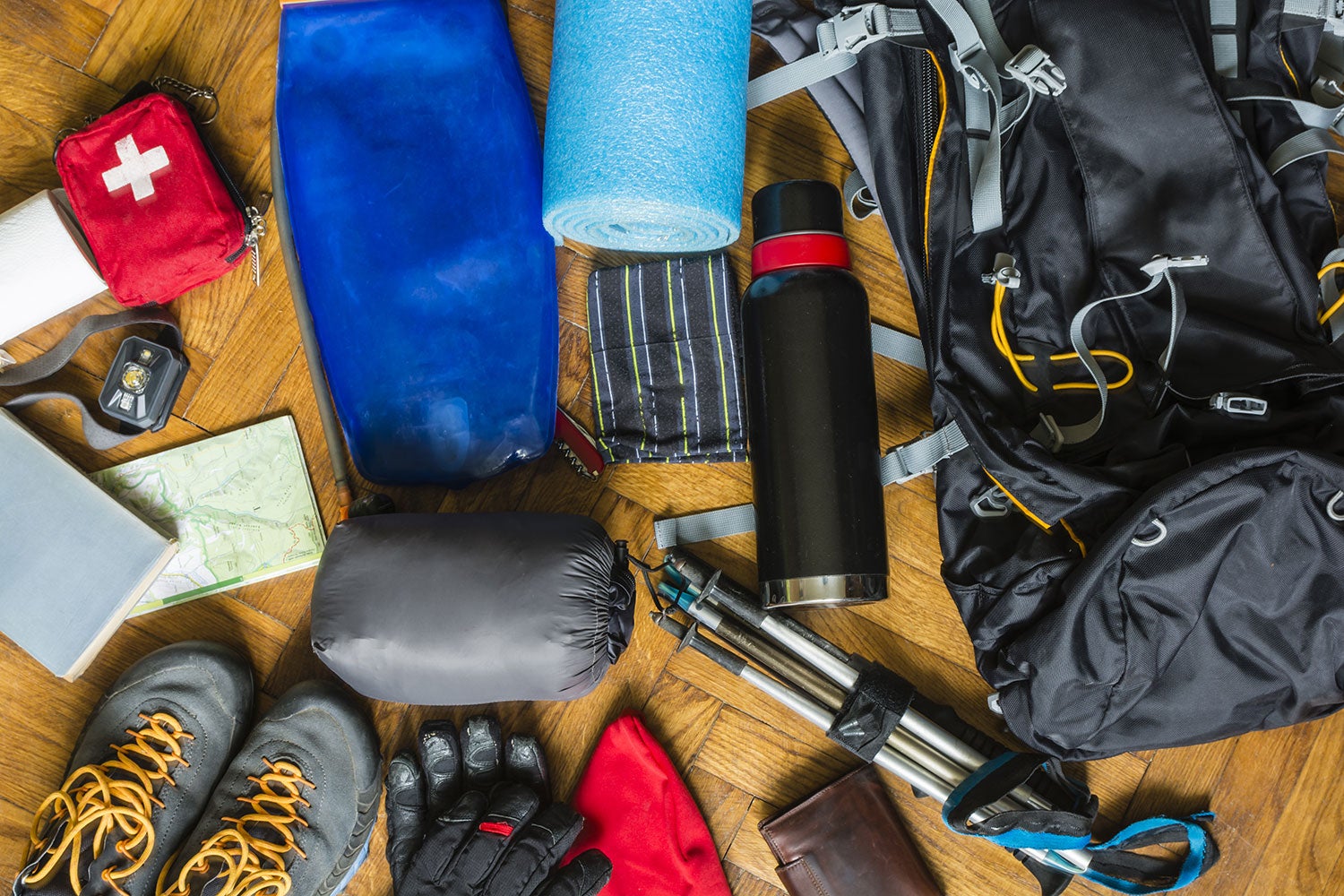 camping gear spread out on the floor 