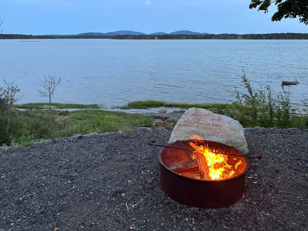 a fire pit near the water at Narrows Too Camping Resort