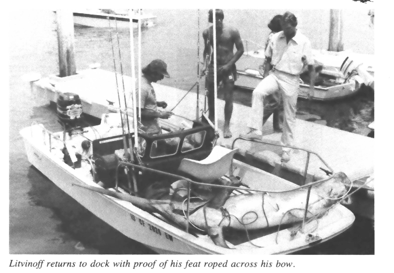 A solo angler with a big swordfish strapped to his boat.