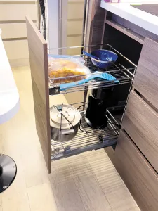 The galley contains a convenient slide-out storage rack. 