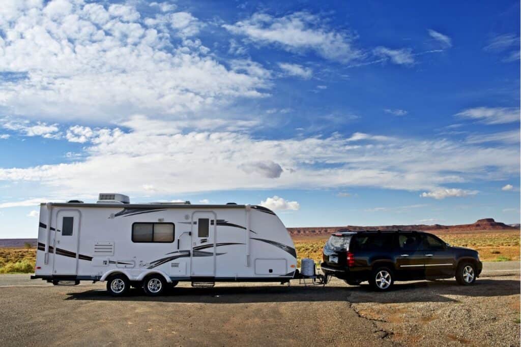 Large SUV towing a travel trailer