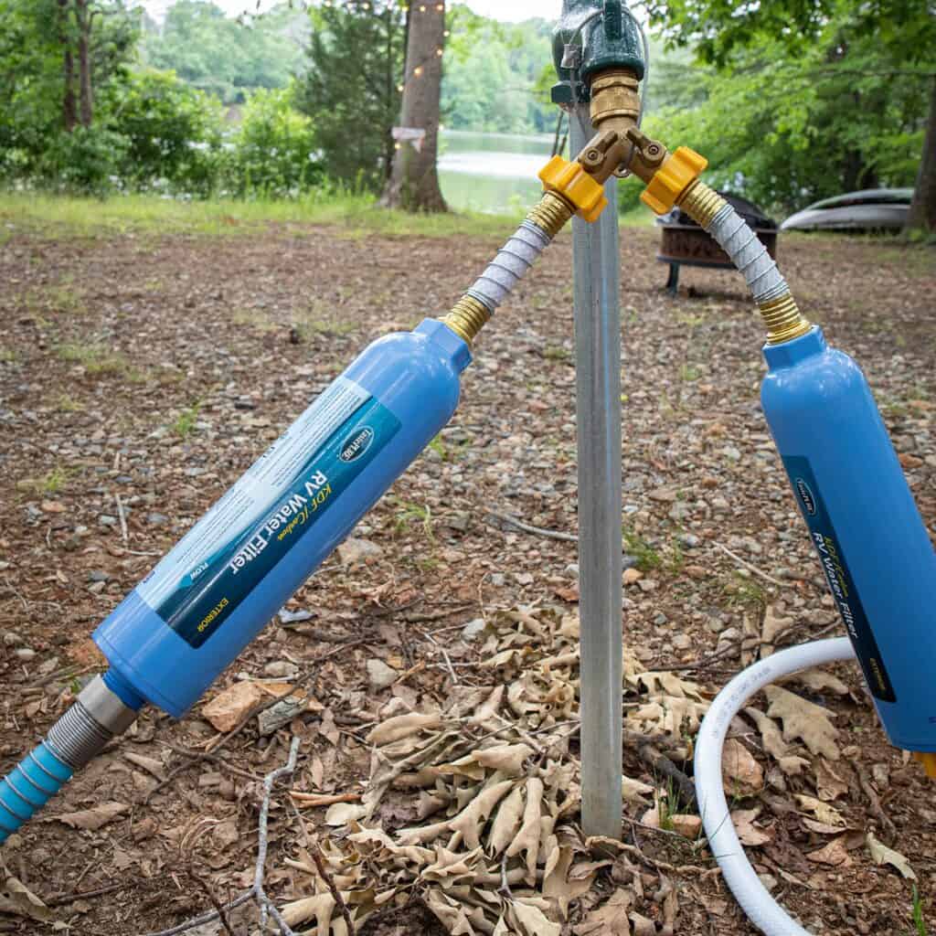 Campground water spigot with two RV water filters attached.