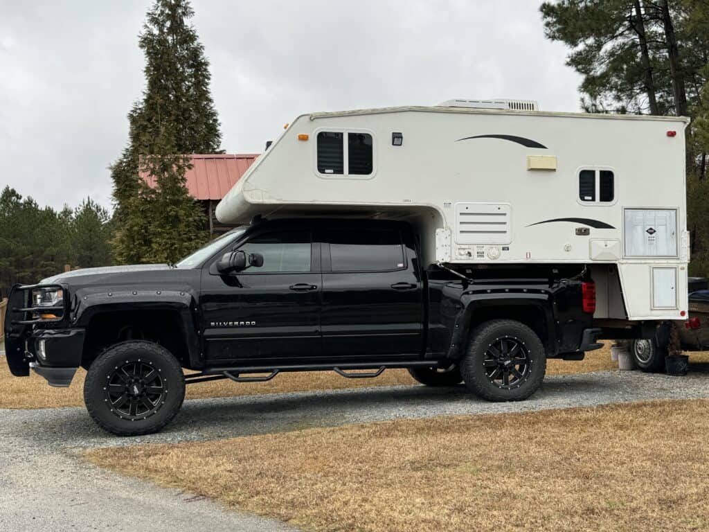 an oversized camper on the back of a truck