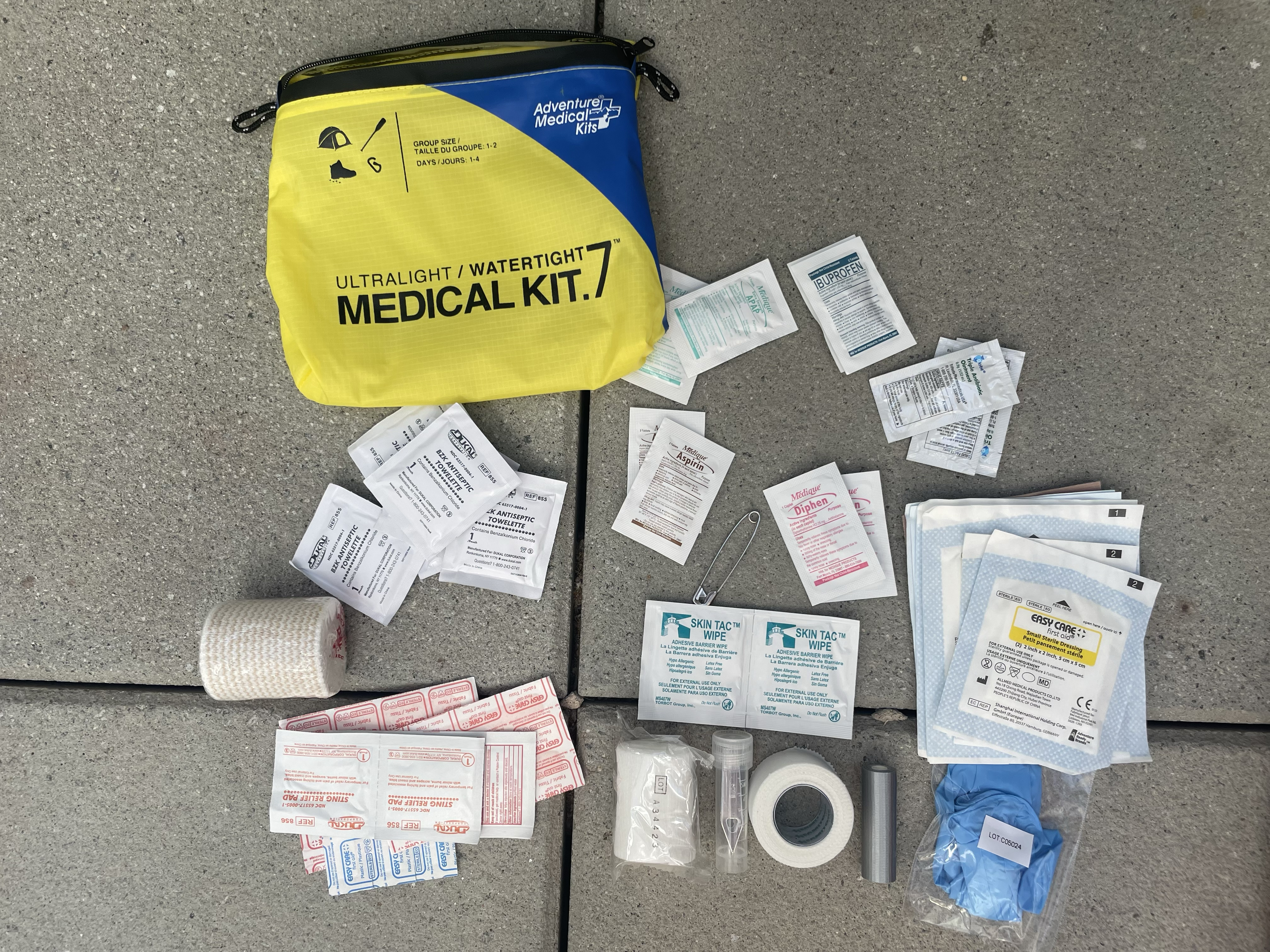 The Adventure Medical Kits Ultralight : Watertight Medical Kit .7 contents are laid out.