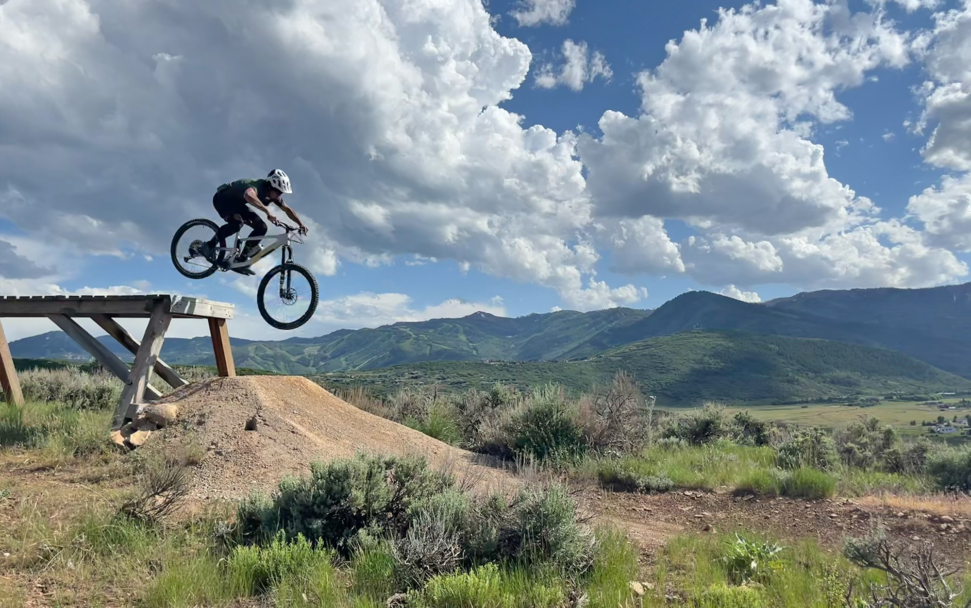 Biker gets air off a drop.