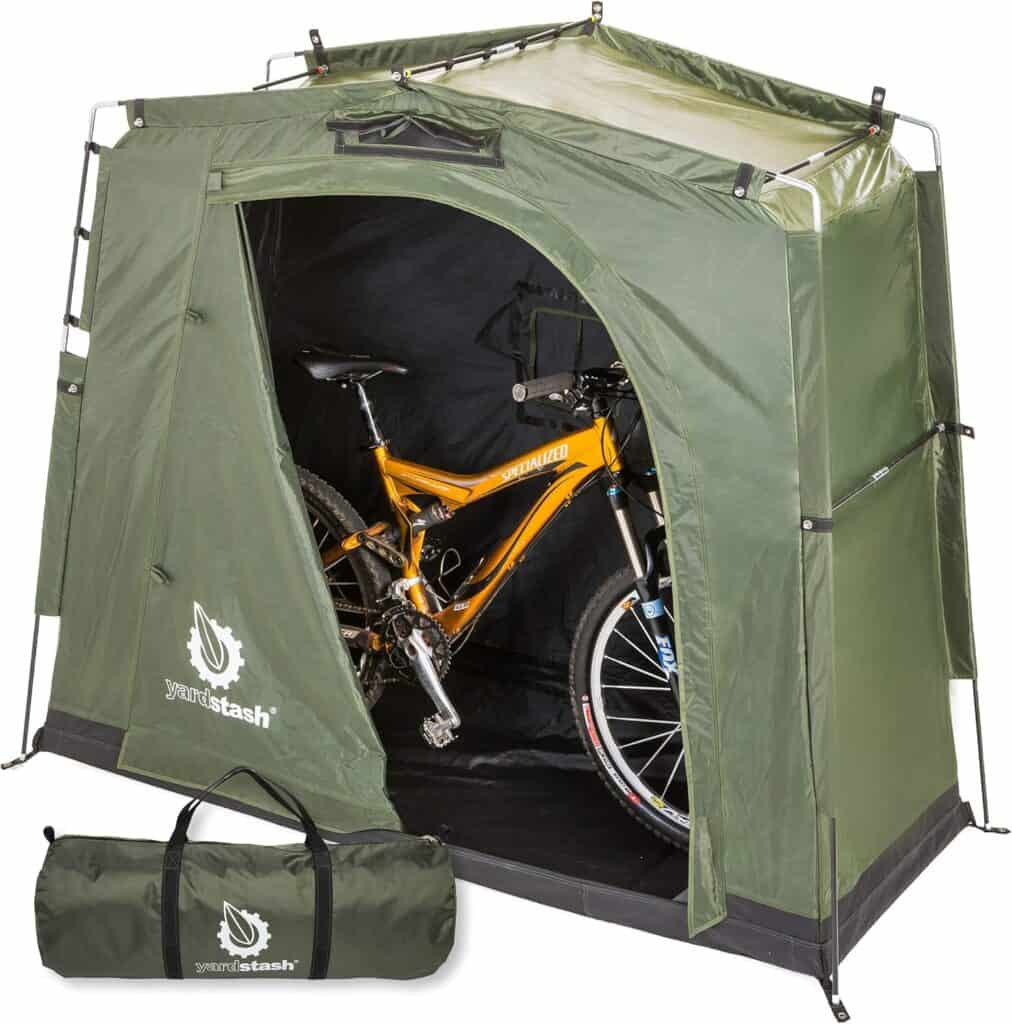 Green portable storage shed with bikes inside and the carrying case it comes with.