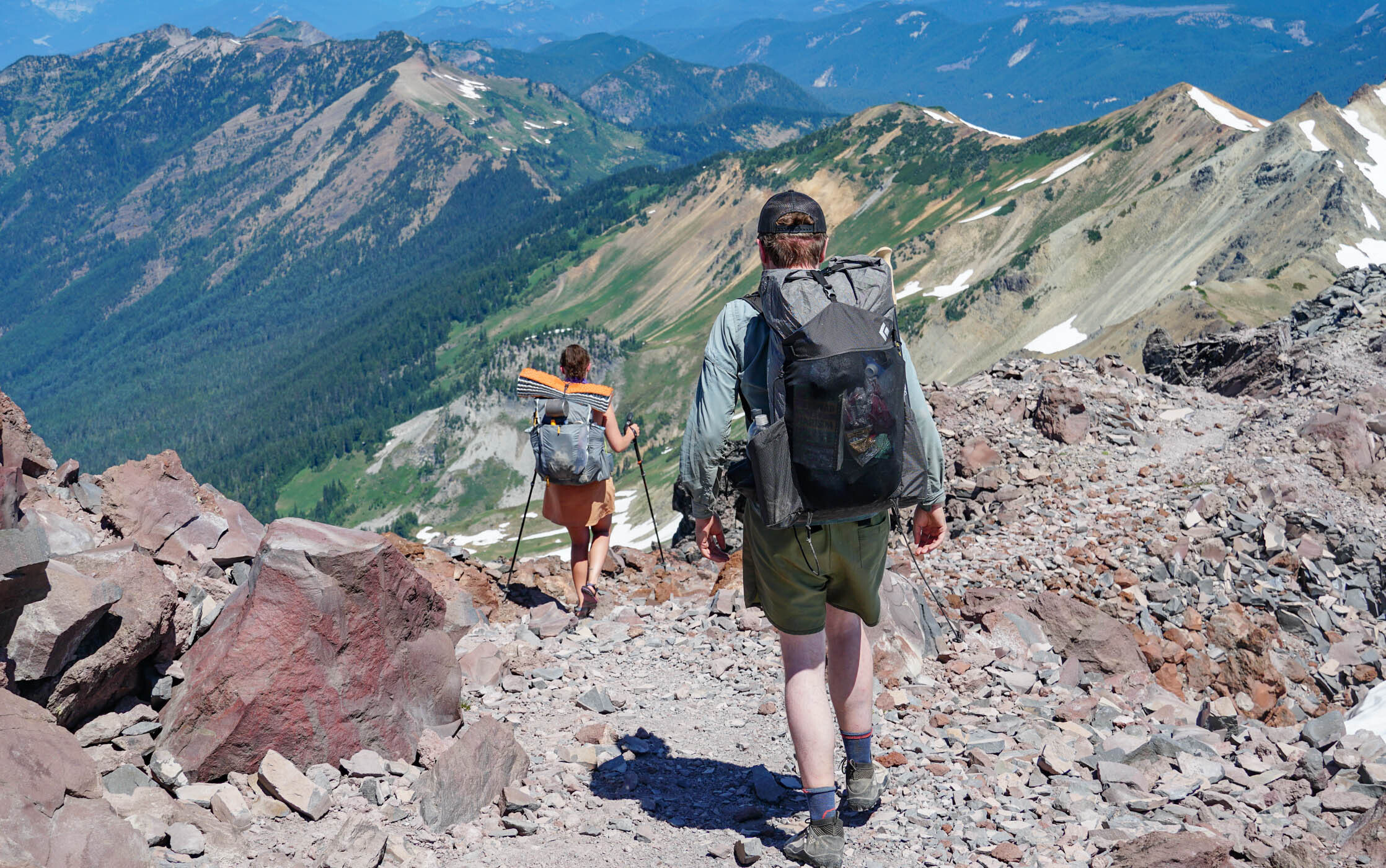 Two backpackers descend Old Snowy.