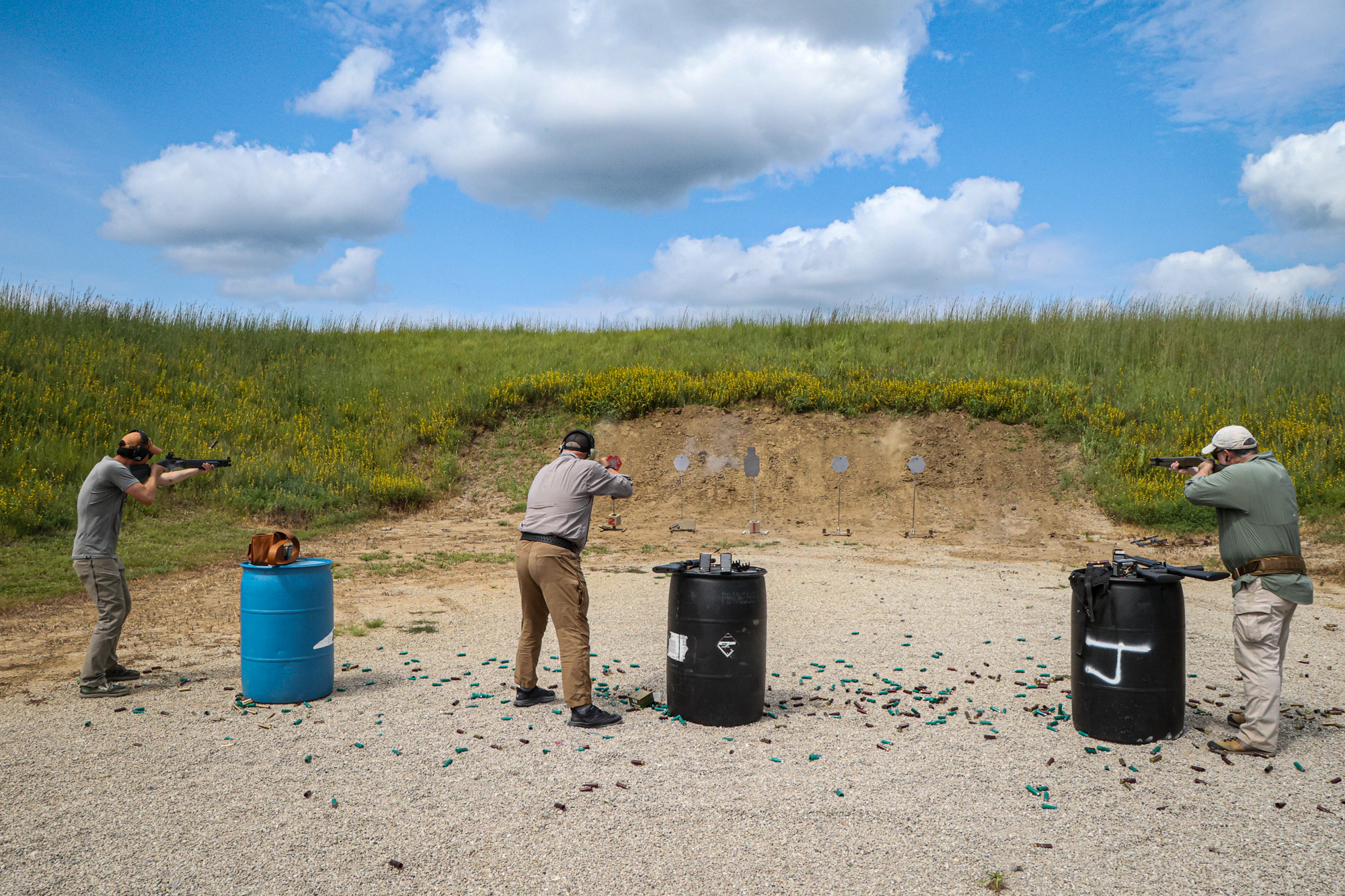 Shooting tactical shotguns at the range.