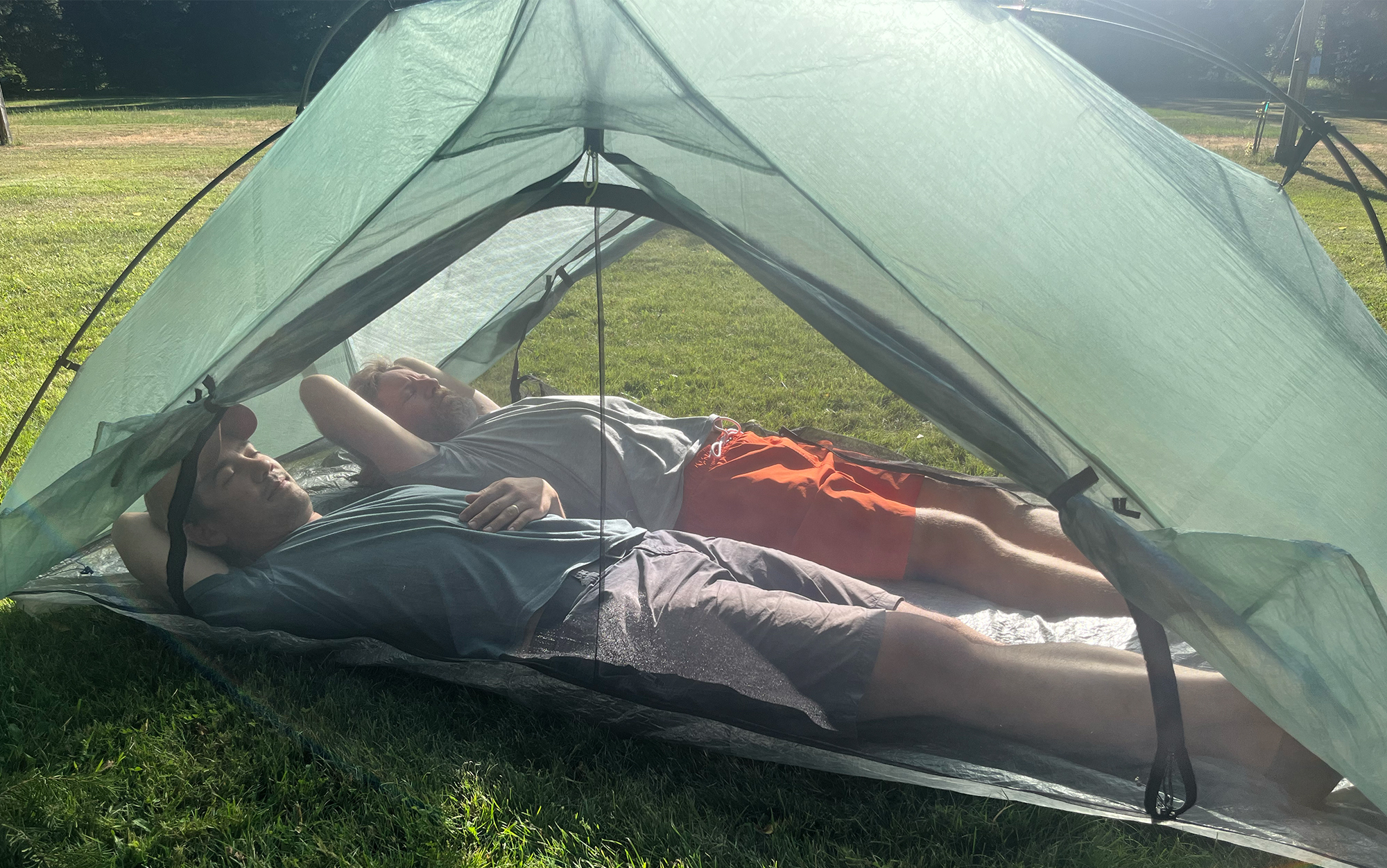 Two men lay down inside the Zpacks Free Zip.