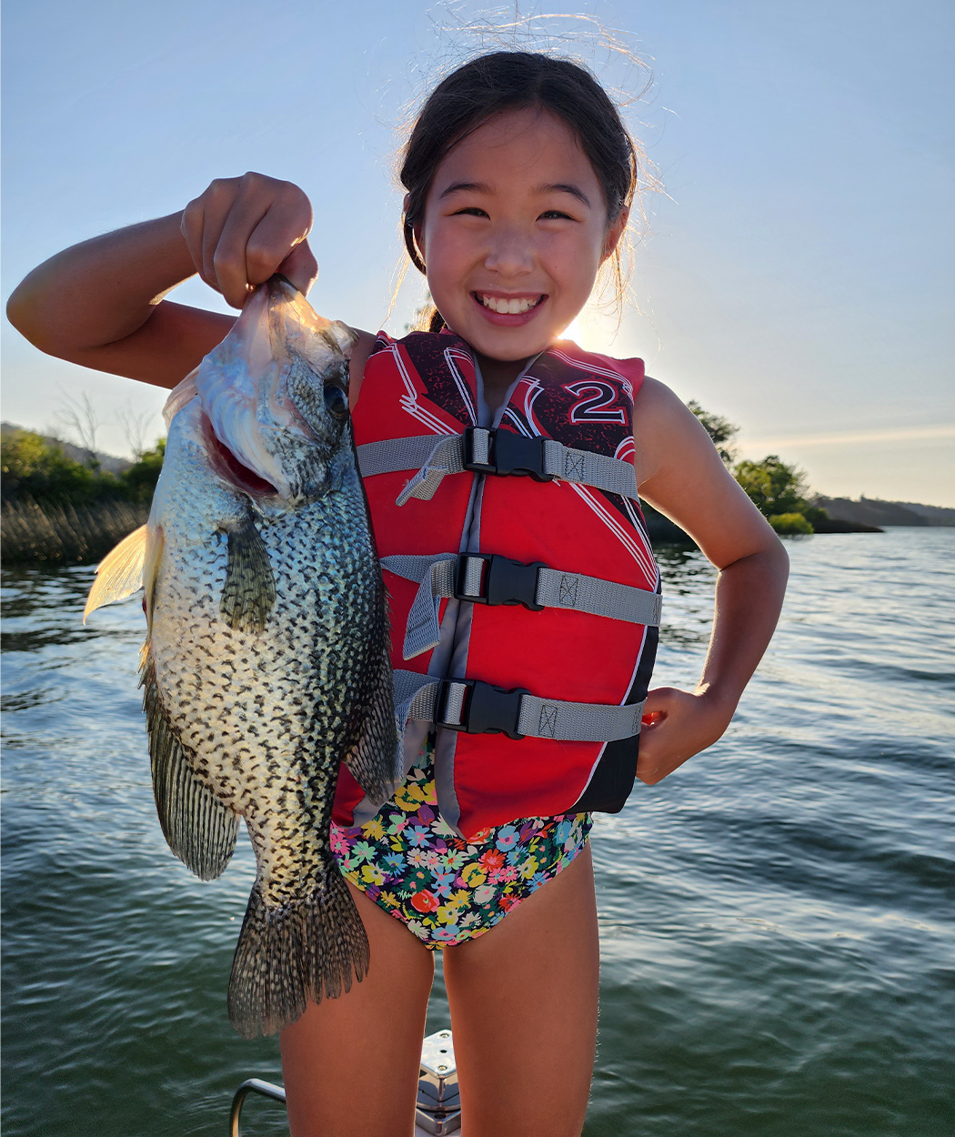 Young angler with big crappie.