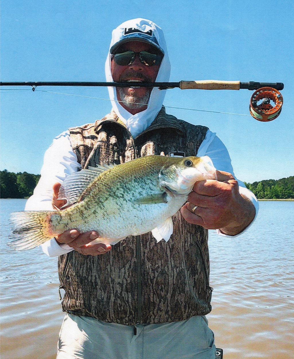 Fly fisherman with crappie.